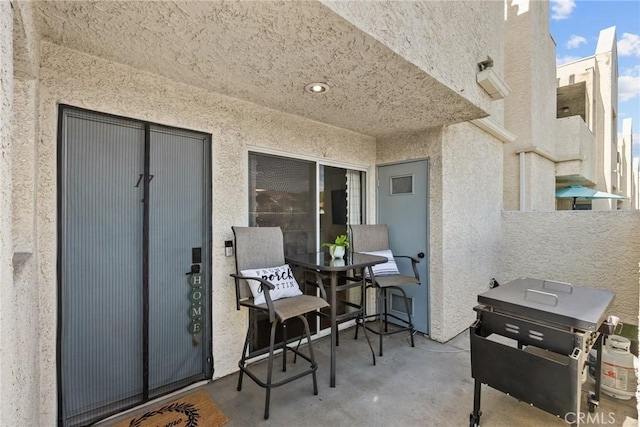 view of patio / terrace featuring fence