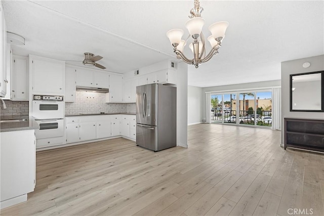 3695 Linden Ave Unit 11A, Long Beach, CA 90807 - kitchen with a sink, decorative backsplash, open floor plan, double oven, and freestanding refrigerator