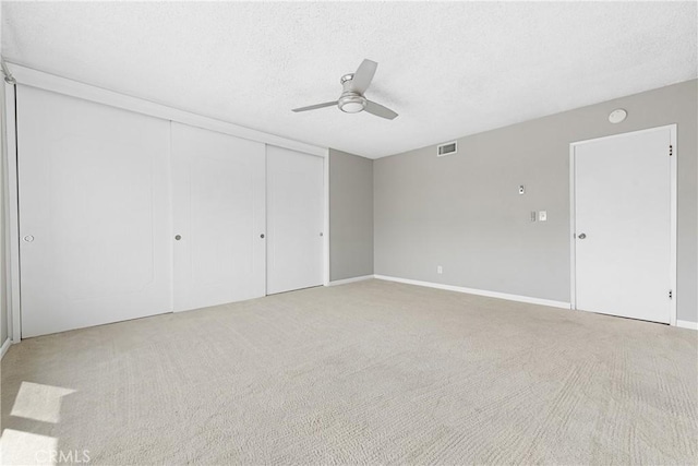 3695 Linden Ave Unit 11A, Long Beach, CA 90807 - unfurnished bedroom featuring a textured ceiling, carpet, visible vents, and baseboards