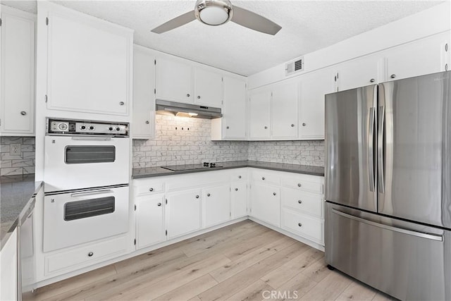3695 Linden Ave Unit 11A, Long Beach, CA 90807 - kitchen featuring ceiling fan, stainless steel appliances, light wood-style flooring, under cabinet range hood, and visible vents