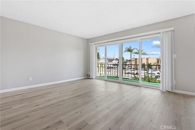 3695 Linden Ave Unit 11A, Long Beach, CA 90807 - unfurnished room featuring light wood finished floors and baseboards