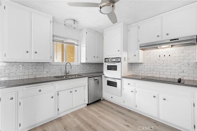 3695 Linden Ave Unit 11A, Long Beach, CA 90807 - kitchen with a sink, white double oven, black electric stovetop, dishwasher, and under cabinet range hood