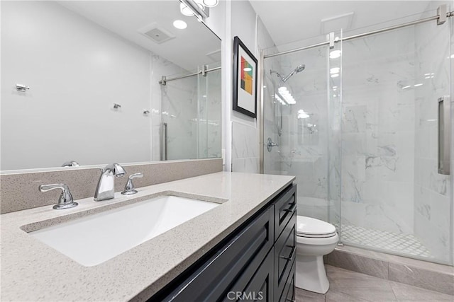 3695 Linden Ave Unit 11A, Long Beach, CA 90807 - bathroom with tile patterned flooring, toilet, vanity, and a marble finish shower