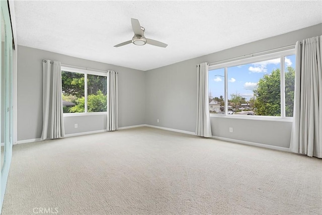 3695 Linden Ave Unit 11A, Long Beach, CA 90807 - empty room with a ceiling fan, baseboards, carpet, and a textured ceiling