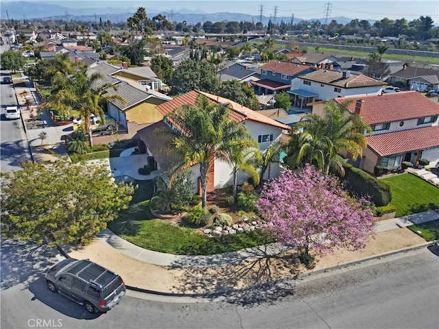 drone / aerial view with a residential view and a mountain view