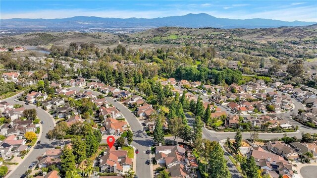 bird's eye view featuring a residential view and a mountain view