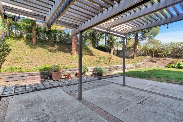 view of patio with fence and a pergola