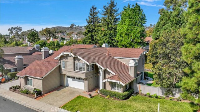 drone / aerial view with a residential view and a mountain view