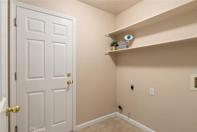 clothes washing area with laundry area, light tile patterned floors, baseboards, hookup for a washing machine, and electric dryer hookup