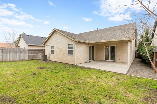 back of house featuring a patio area, a fenced backyard, a lawn, and stucco siding