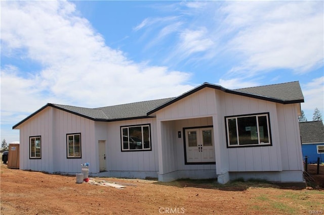 view of front of home with a shingled roof