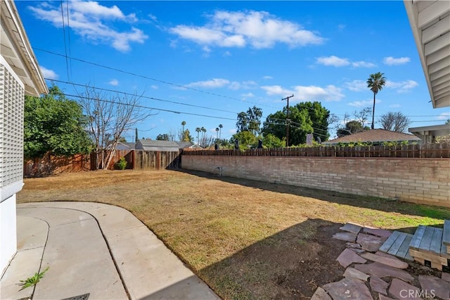 view of yard featuring a fenced backyard