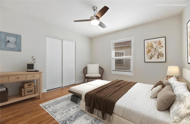 bedroom featuring a closet, a ceiling fan, and wood finished floors