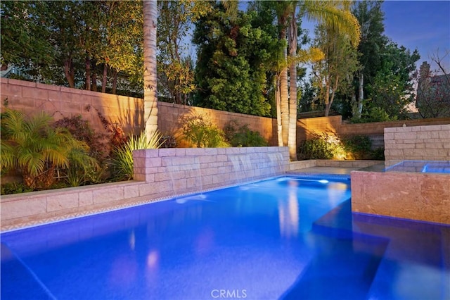 view of swimming pool with a fenced backyard and a fenced in pool