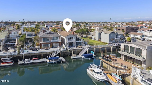 drone / aerial view featuring a water view and a residential view