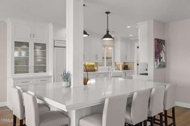 dining room featuring recessed lighting, dark wood finished floors, and baseboards