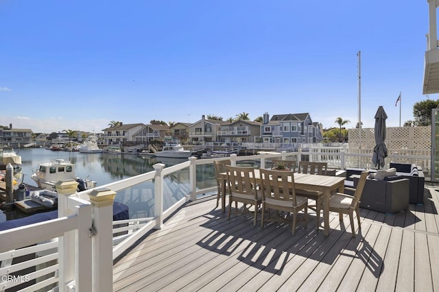 deck featuring a water view and a residential view