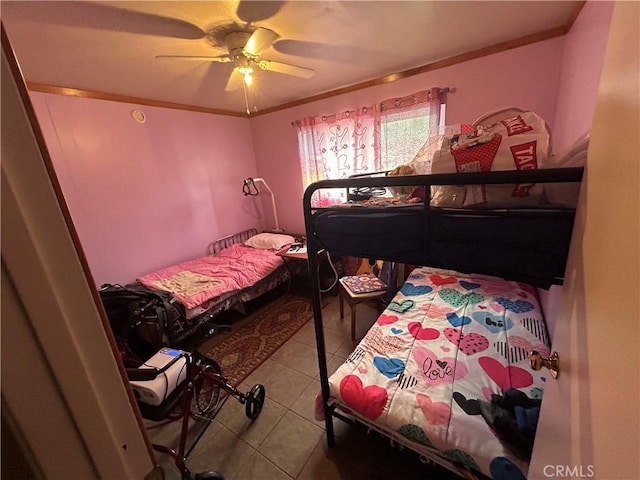 bedroom with light tile patterned floors, ceiling fan, and crown molding