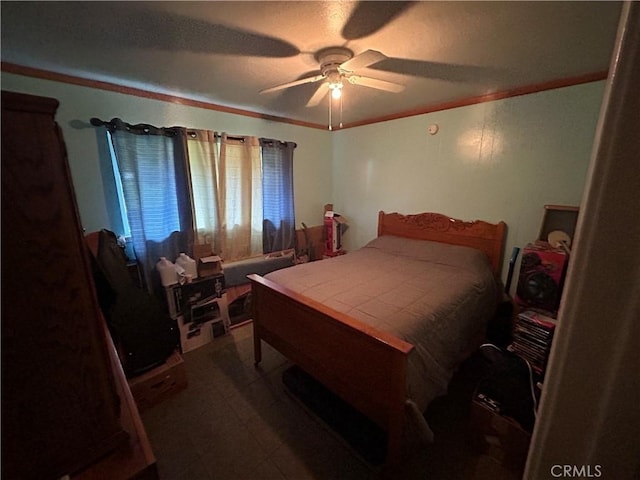 bedroom featuring crown molding and ceiling fan