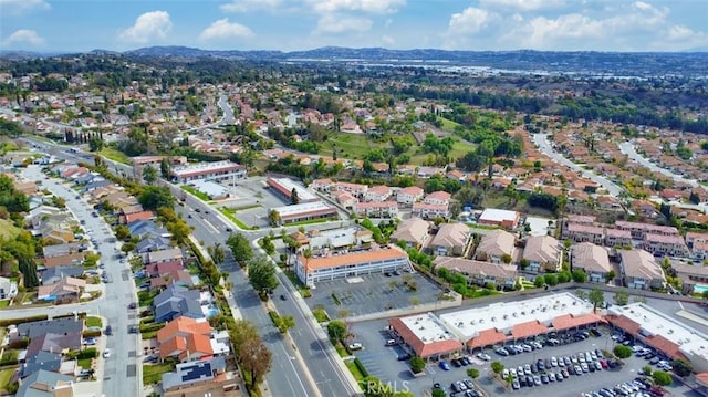 birds eye view of property featuring a residential view and a mountain view