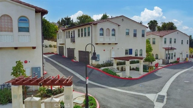 view of road with a residential view and curbs