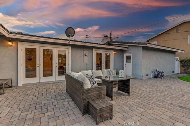 patio terrace at dusk with french doors