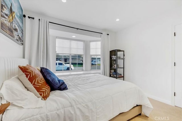 bedroom featuring radiator heating unit, baseboards, carpet flooring, and recessed lighting