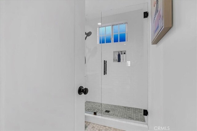 bathroom with a shower stall