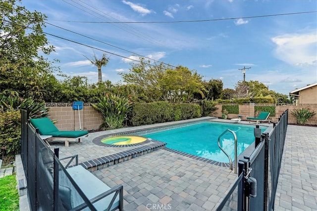 view of swimming pool with a fenced in pool, a patio area, a fenced backyard, and an in ground hot tub