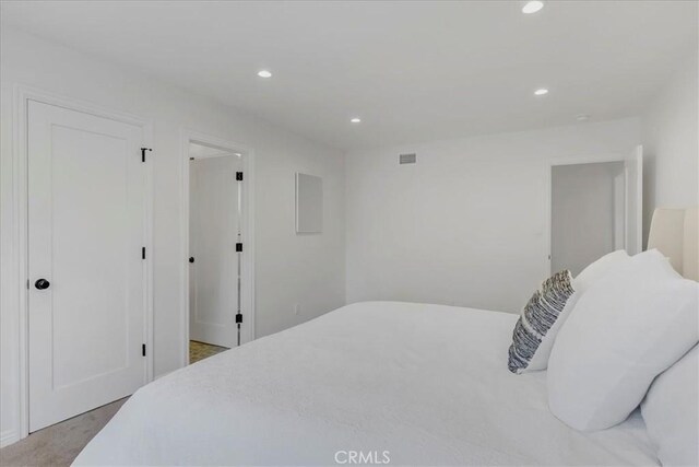 bedroom featuring visible vents and recessed lighting