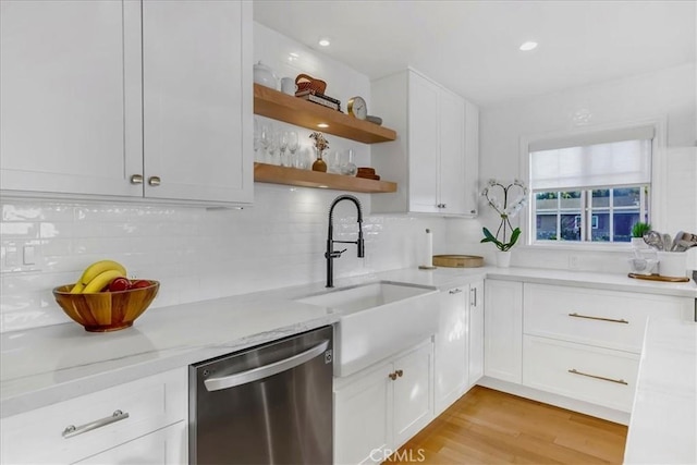 kitchen featuring light wood-style floors, white cabinets, backsplash, dishwasher, and open shelves