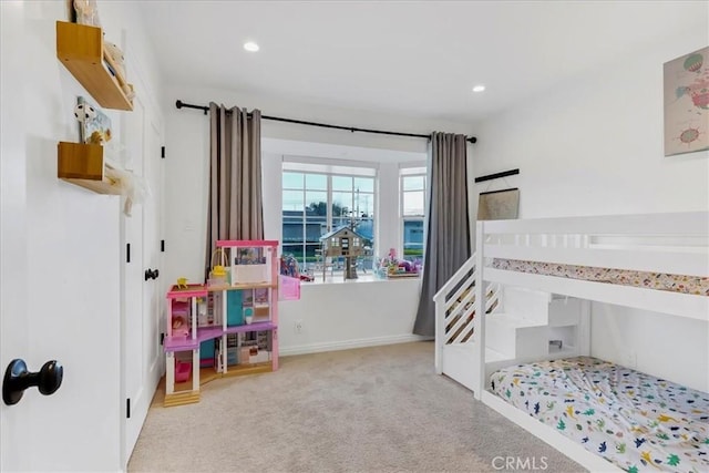 carpeted bedroom with recessed lighting