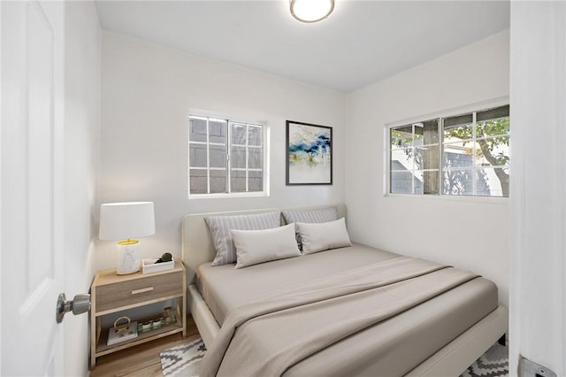 bedroom with wood finished floors