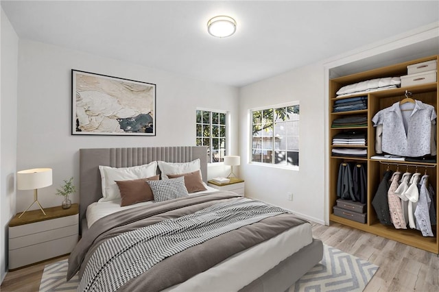 bedroom with a closet and light wood-type flooring