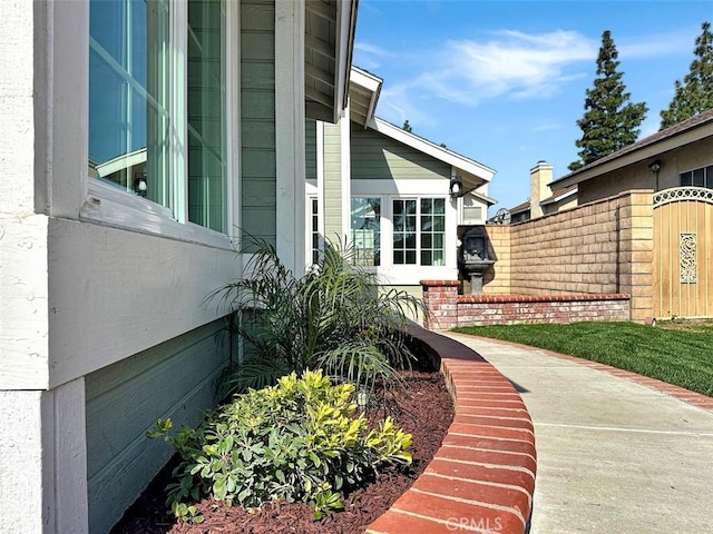 view of side of property with fence