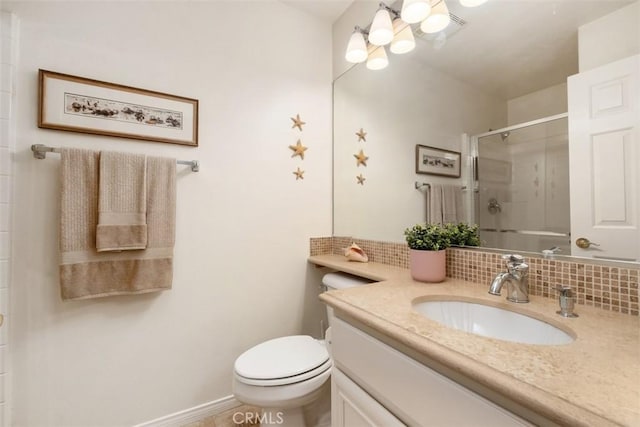 full bath featuring a stall shower, baseboards, vanity, and decorative backsplash