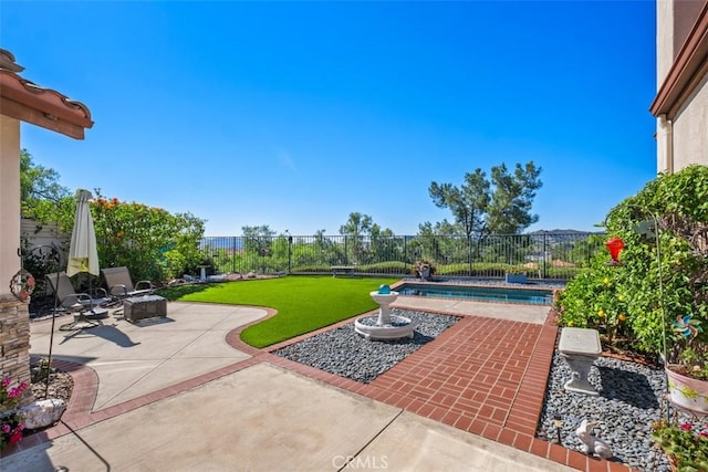 view of patio / terrace featuring a fenced backyard and a fenced in pool