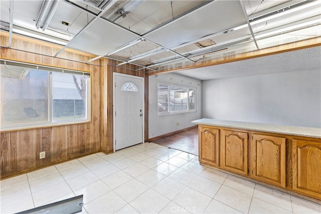 interior space with wooden walls and baseboards