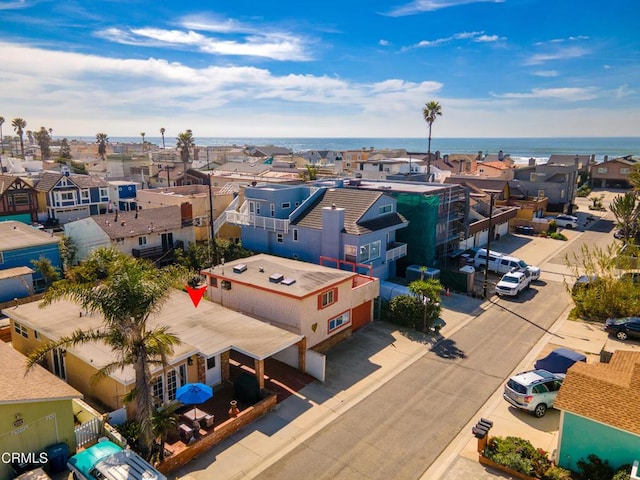 drone / aerial view with a residential view and a water view