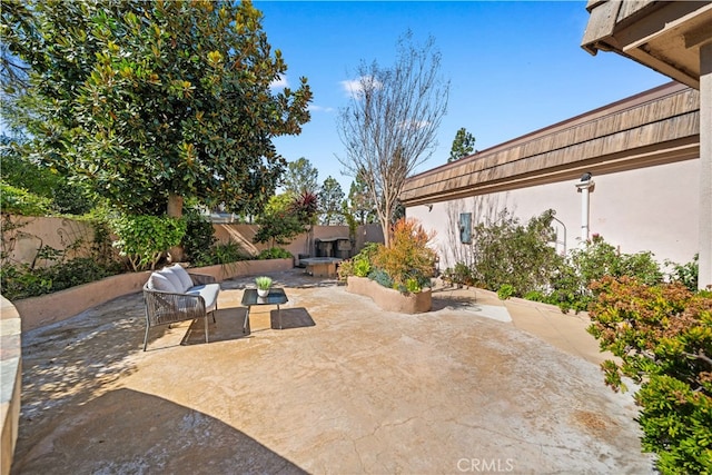 view of patio / terrace featuring a fenced backyard and outdoor lounge area