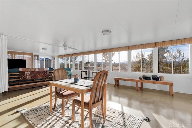 sunroom / solarium featuring ceiling fan