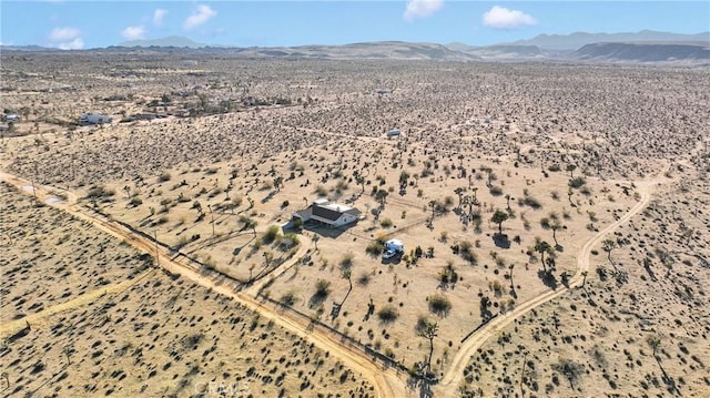 bird's eye view featuring view of desert and a mountain view