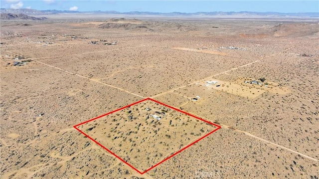 aerial view with a desert view and a mountain view