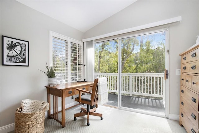 home office with vaulted ceiling and baseboards