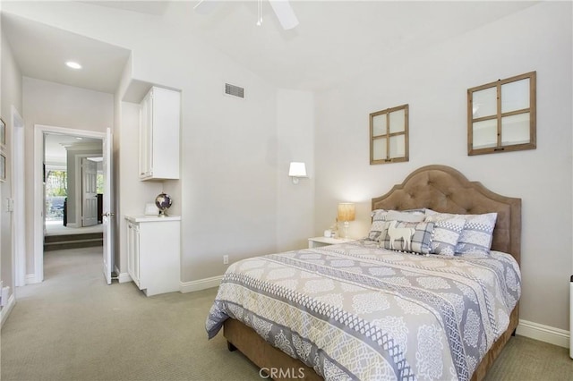 bedroom featuring ceiling fan, lofted ceiling, light carpet, visible vents, and baseboards