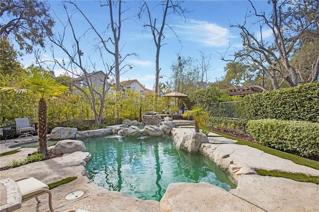 view of pool featuring fence and a fenced in pool