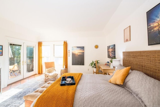 bedroom featuring access to outside, french doors, and light tile patterned floors