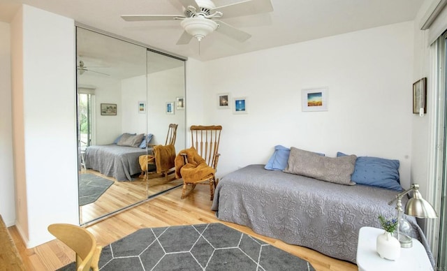 bedroom featuring a closet, ceiling fan, and wood finished floors