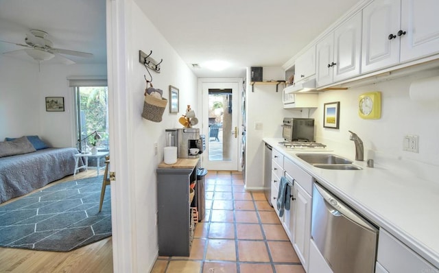 kitchen with dishwasher, open shelves, a sink, and white cabinets