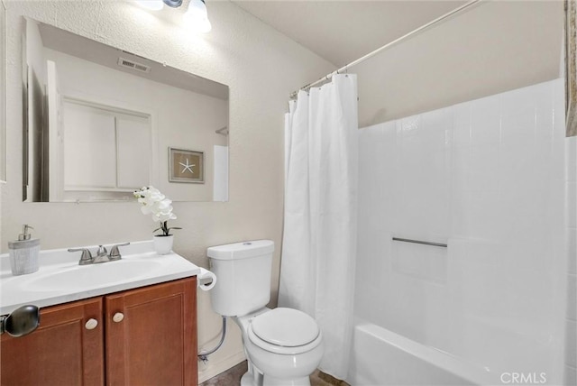 bathroom featuring toilet, shower / bath combo, visible vents, and vanity